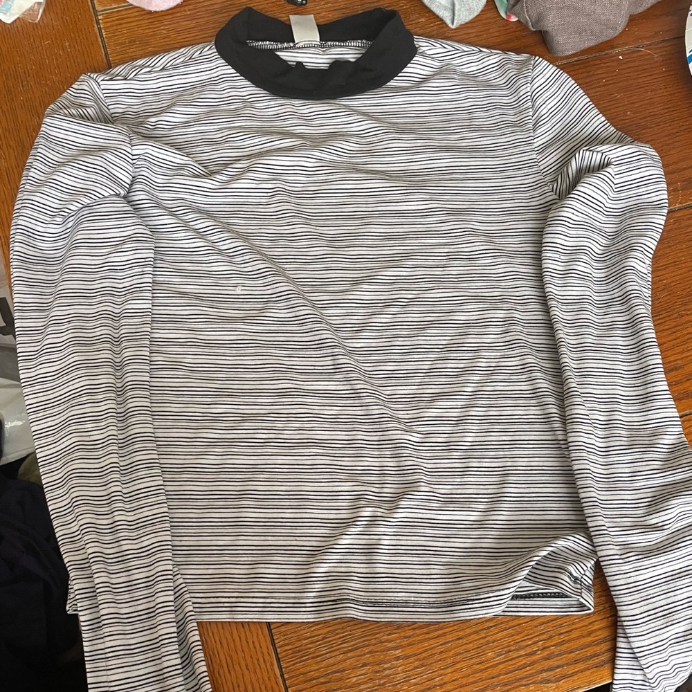 It is a tight black and white stoped shirt.